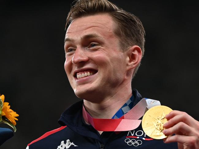 Gold medallist Norway's Karsten Warholm poses on the podium after winning the men's 400m hurdles event. Picture: AFP