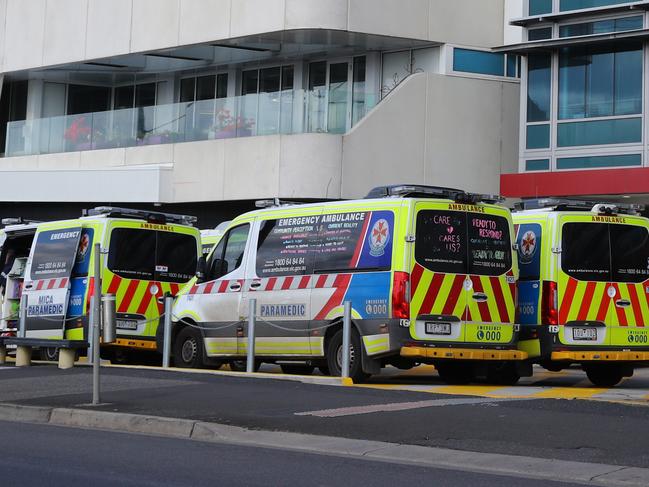 Some of the 11 ambulances ramped at Geelong Hospital just before 1pm. Picture: Alison Wynd