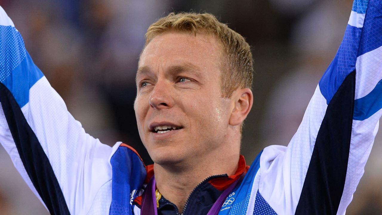 (FILES) Great Britain's Chris Hoy poses on the podium after winning the gold medal in the London 2012 Olympic Games men's keirin final cycling event at the Velodrome in the Olympic Park in East London on August 7, 2012. Six-time Olympic cycling champion Chris Hoy revealed on October 19 that he has terminal cancer and has been told by doctors he has "two to four years" to live. The 48-year-old former track racer announced in February that he had been diagnosed with the disease and was undergoing chemotherapy but insisted the treatment was "going really well". (Photo by LEON NEAL / AFP)