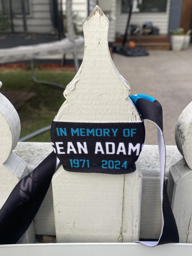 One of the 600 bands made to honour Sean Adams’ memory, on a front fence in Newport.