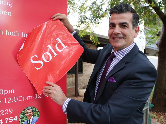 Weekend Auction at 21 Wilson Street, Newtown. A bidding war between 2 bidders took the sale over 2 million. Pictured is the Agent Michael Xanthoudakis. Picture: David Swift.