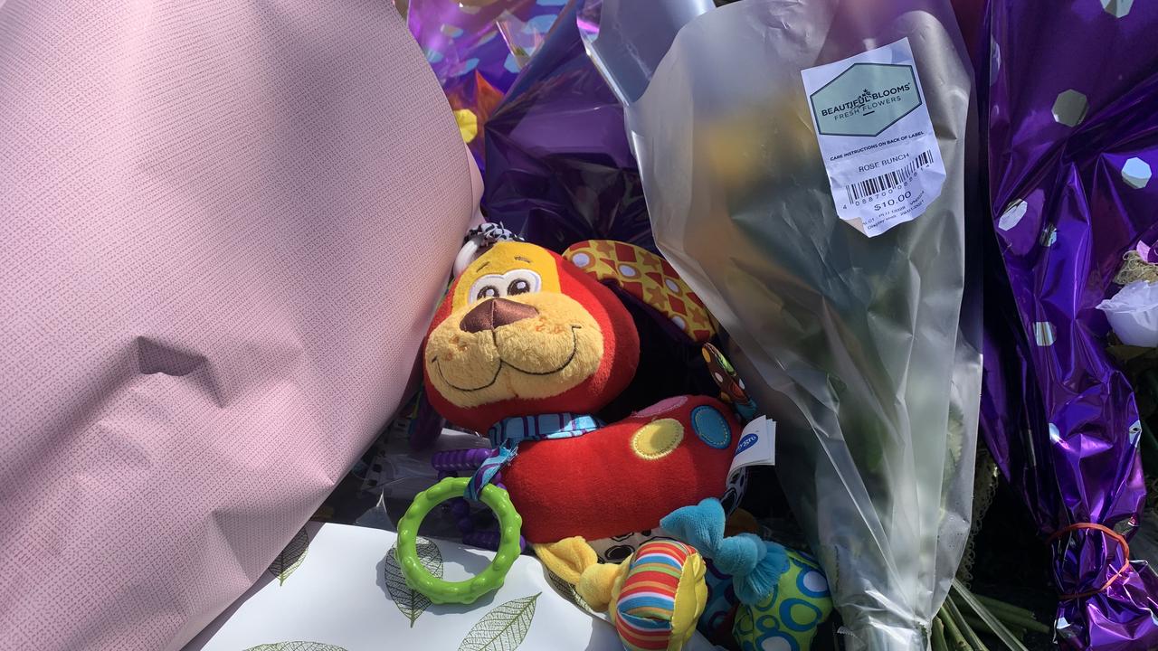 A stuffed baby teething toy left at the scene of an accident where pregnant Kate Leadbetter and her partner were killed on Tuesday. Picture: James Hall