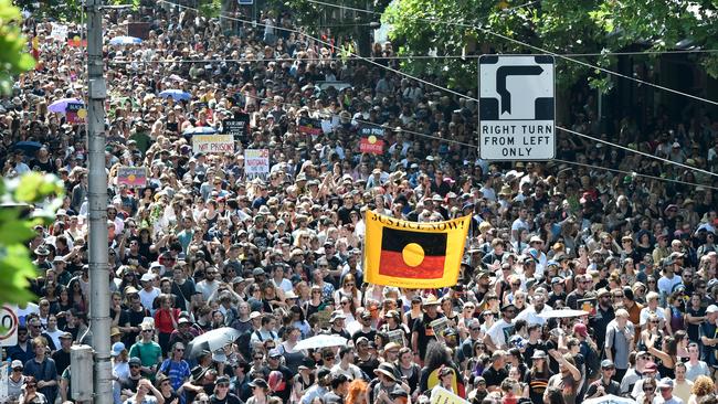 Protesters march on Australia Day in Melbourne’s CBD. Picture: Jason Edwards