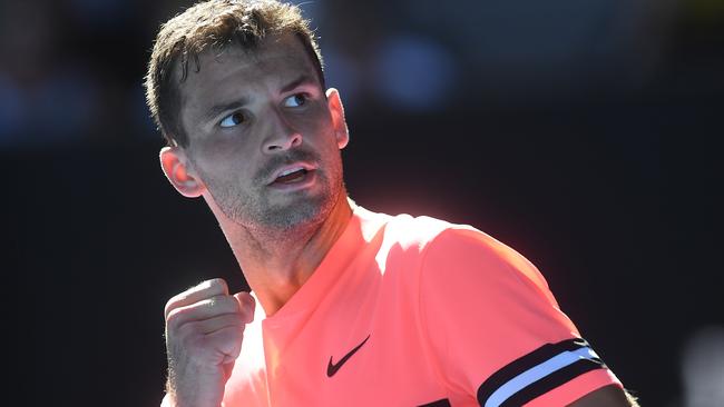 Grigor Dimitrov celebrates beating Dennis Novak.