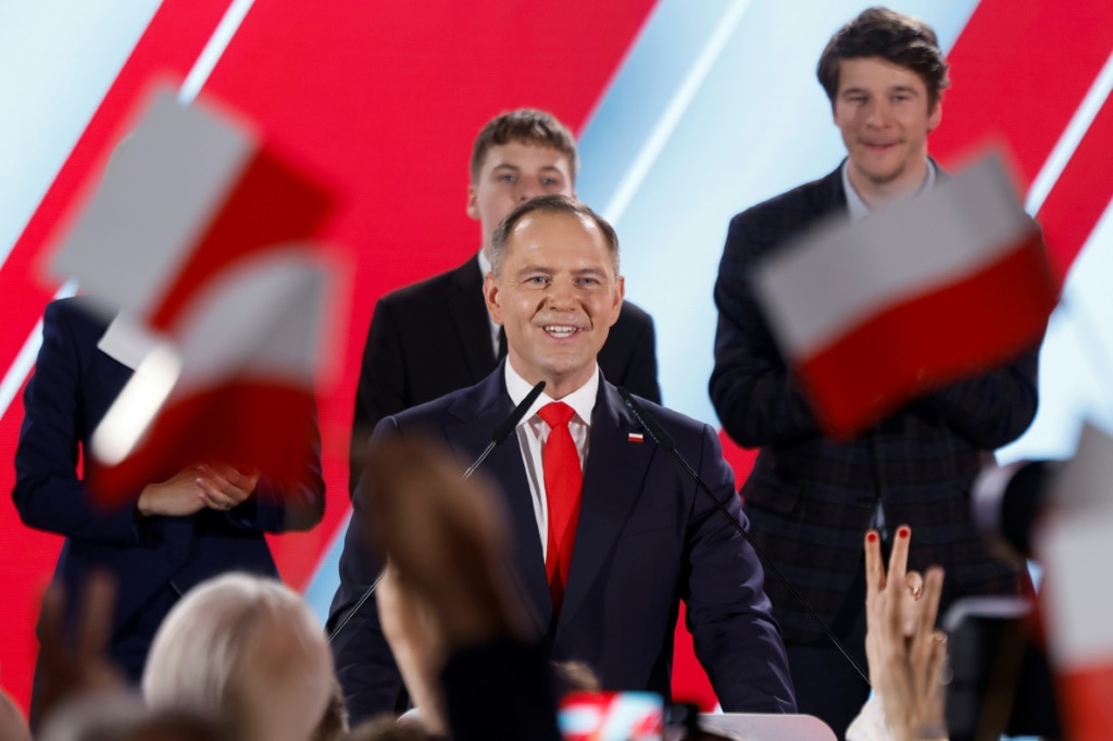 Poland holds tight vote with EU role at stake