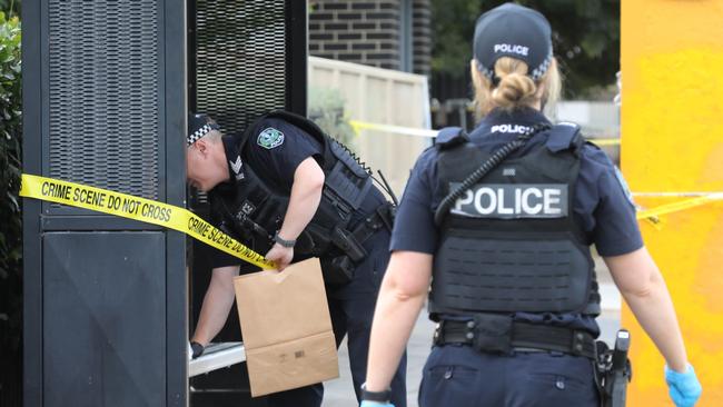 Officers were seen collecting evidence from a bus stop on Churchill Rd. Picture: Dean Martin