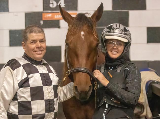 Grant and Trista Dixon with champion pacer Leap To Fame. Picture: Dan Costello