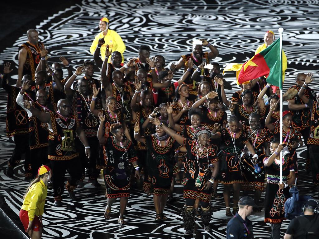 The Cameroon team marches into Carrara Stadium for the opening ceremony for the 2018 Commonwealth Games on the Gold Coast, Australia. Cameroon officials said Wednesday, April 11, 2018, that eight of their athletes at the Commonwealth Games have gone missing from the athletes village, with two failing to turn up for competitions. (AP Photo/Mark Schiefelbein)