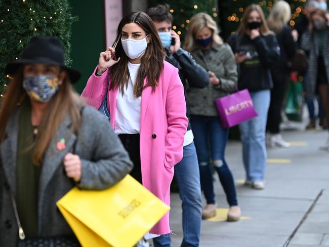 Shoppers queue outside Selfridges on Oxford Street in central London as the country prepares for a second national lockdown. Picture: AFP