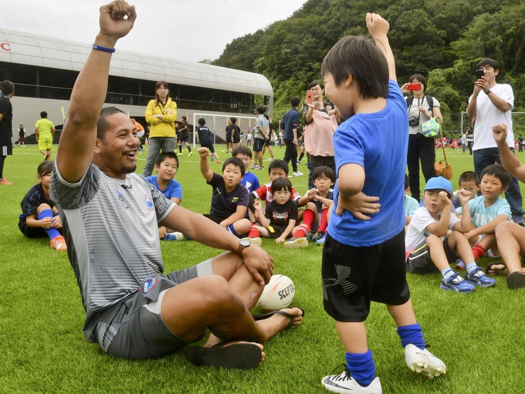 Samoa rugby team members take part in a clinic with schoolchilden in Iwaki, northern Japan, ahead of the World Cup. Picture: AP