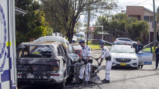 A burnt out Audi Q7 near the scene of the shooting in southwest Sydney. Picture: Liam Mendes