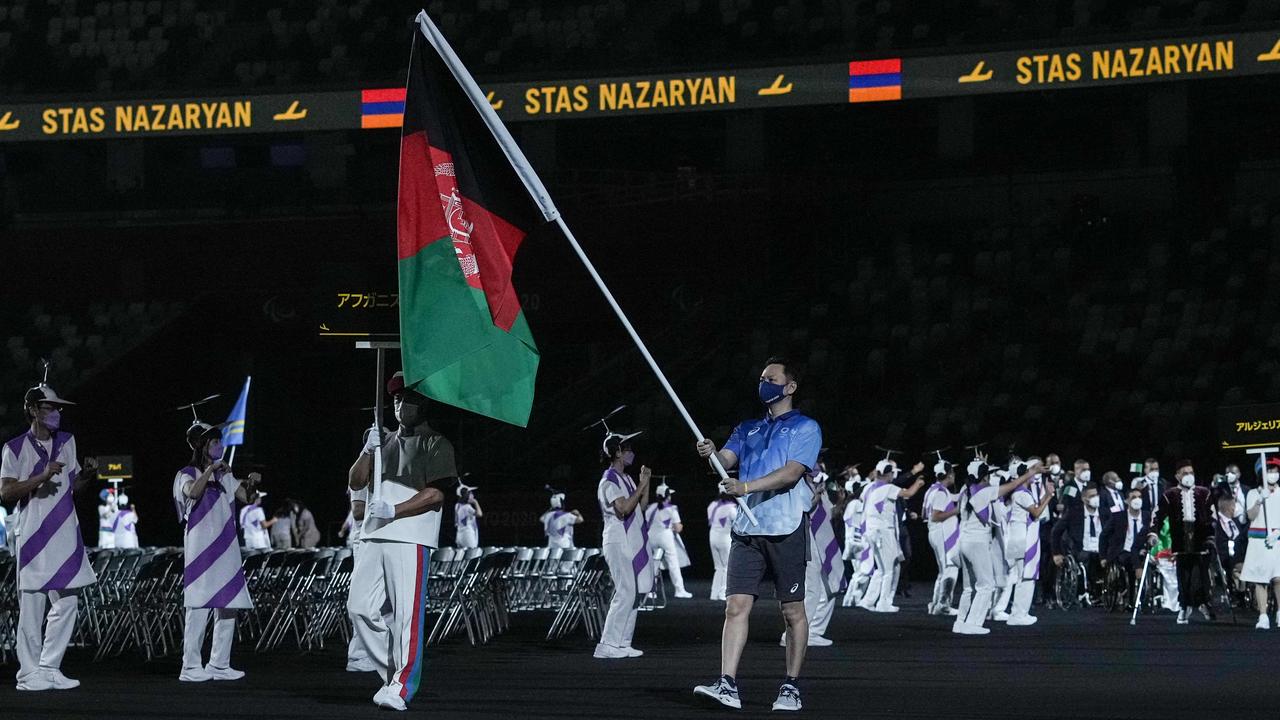 The flag of Afghanistan is carried out at the opening ceremony for the Tokyo 2020 Paralympic Games at the Olympic Stadium in Tokyo.