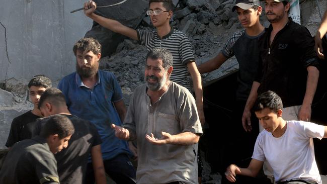 A Palestinian man reacts after a home was hit in an Israeli air strike in Rafah, in the southern Gaza Strip, amid the ongoing battles between Israel and the Palestinian group Hamas. Picture: AFP