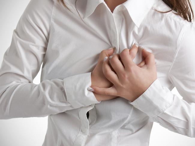 Generic photo of a woman having a heart attack - chest pains. Picture: iStock