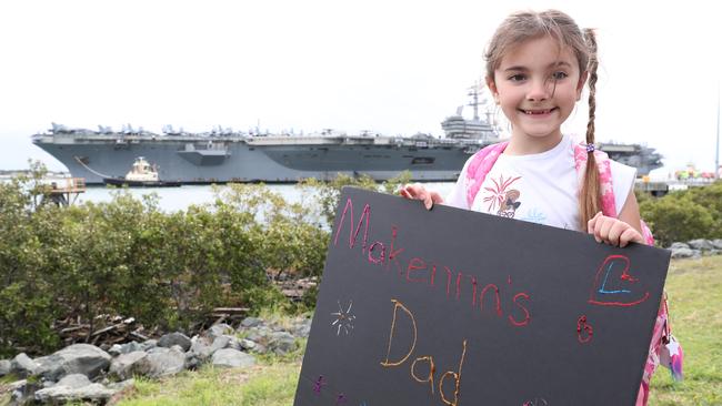 Makenna Klein (6) waves  at the ship looking for her dad. The USS Ronald Reagan arrives in Brisbane.  Pic Peter Wallis