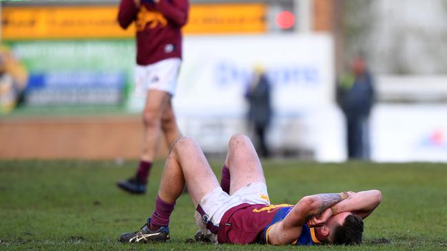 A dejected South Morang player after the final siren. Picture: Andy Brownbill