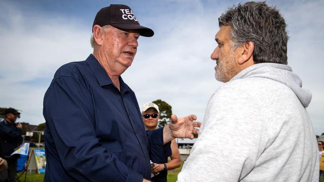 Ian Cook with a voter in the Mulgrave electorate during the 2022 Victorian election. Picture: Mark Stewart