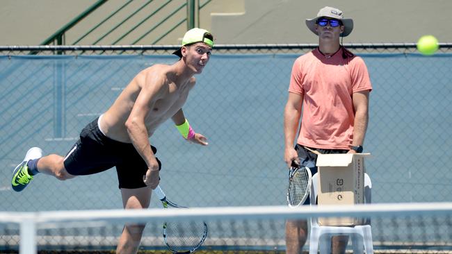 Thanasi Kokkinakis’ coach Todd Langman (right) has stuck by his side through the good and bad times. Picture: Dave Cronin