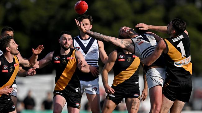 Hamish Shepheard battles Sam Gilmore in the ruck. Picture: Andy Brownbill