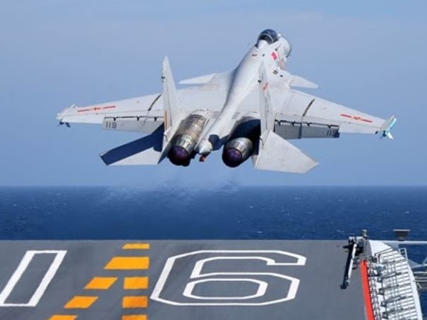 A J-15 carrier-borne fighter jet takes off from the flight deck of the aircraft carrier Liaoning during a maritime training exercise. Picture: eng.chinamil.com.cn/Li Tang