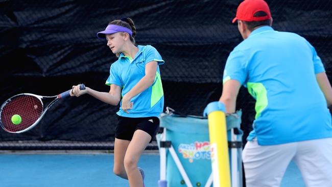 Wayne Fielder and his daughter Maddy, 13, at the Cairns International Tennis Centre. PICTURE: STEWART McLEAN