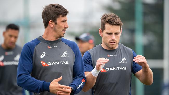 Jake Gordon and Bernard Foley talk tactics at Wallabies training. Photo: Stuart Walmsley/Rugby AU Media