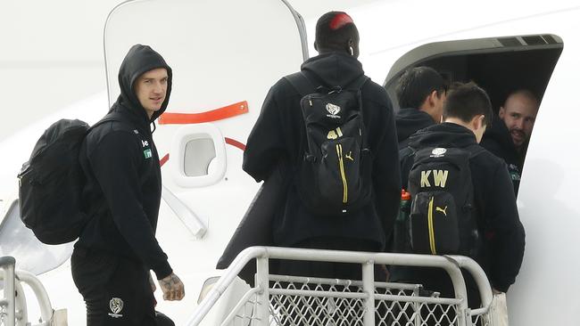 Goodbye Melbourne. Dustin Martin and Richmond players get on a flight out of the city on Monday, July 6, to join one of the AFL’s interstate hubs. Picture: Getty