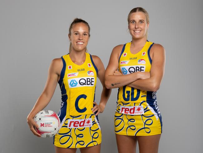 Swifts co-captain Paige Hadley (left) and Maddy Turner in the club's heritage dress. Hadley will play her 150th game for the club on Sunday. Photo: Narelle Spangher, Netball NSW