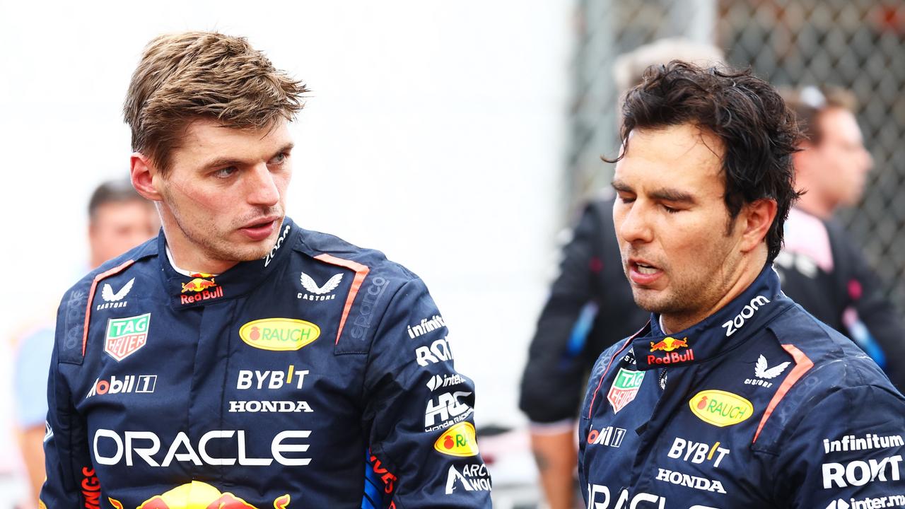 MONZA, ITALY - SEPTEMBER 01: Sixth place Max Verstappen of the Netherlands and Oracle Red Bull Racing and eighth place Sergio Perez of Mexico and Oracle Red Bull Racing, look on in parc ferme during the F1 Grand Prix of Italy at Autodromo Nazionale Monza on September 01, 2024 in Monza, Italy. (Photo by Mark Thompson/Getty Images)