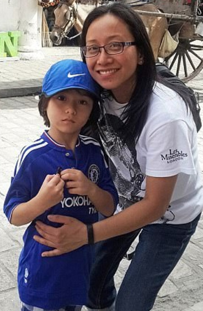 Injured Barcelona terror attack victim Jom Cadman with her seven year old son Julian who was killed in the atrocity. Picture: Supplied