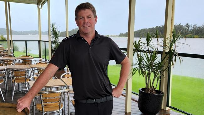 Island Golf Club general manager Johnathon Zirkler is nervously watching the skies after the course was almost completely inundated by floodwater 12 months ago.