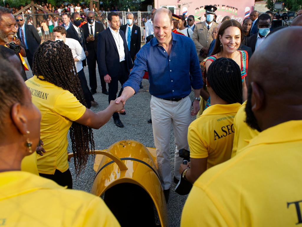 The couple meets with members of the Jamaica Bobsleigh team. Picture: AFP