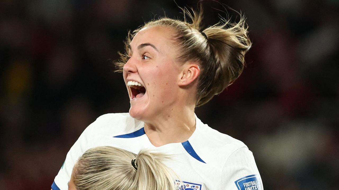 TOPSHOT - England's forward #23 Alessia Russo celebrates with teammates after scoring a goal during the Australia and New Zealand 2023 Women's World Cup quarter-final football match between Colombia and England at Stadium Australia in Sydney on August 12, 2023. (Photo by STEVE CHRISTO / AFP)