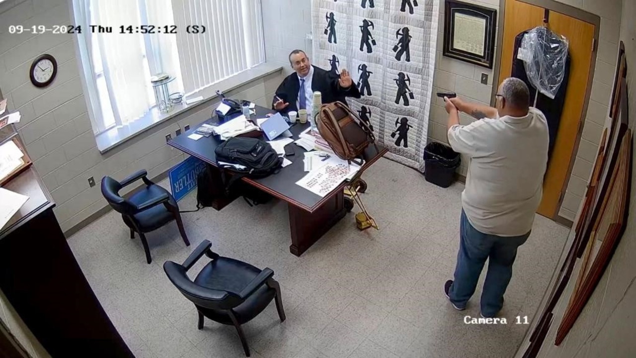 Footage shows Letcher County Sheriff Shawn Stines pointing his gun at District Judge Kevin Mullins after what appeared to be a heated exchange. Picture: KY Courts