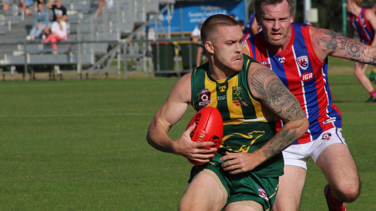 Maroochydore Roos player Sam McKenzie seizes control against Wilston Grange in the QAFL. Picture: Tom Threadingham