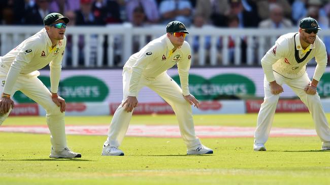 Cameron Bancroft, Steve Smith and David Warner stand in the slips. Picture: AFP.