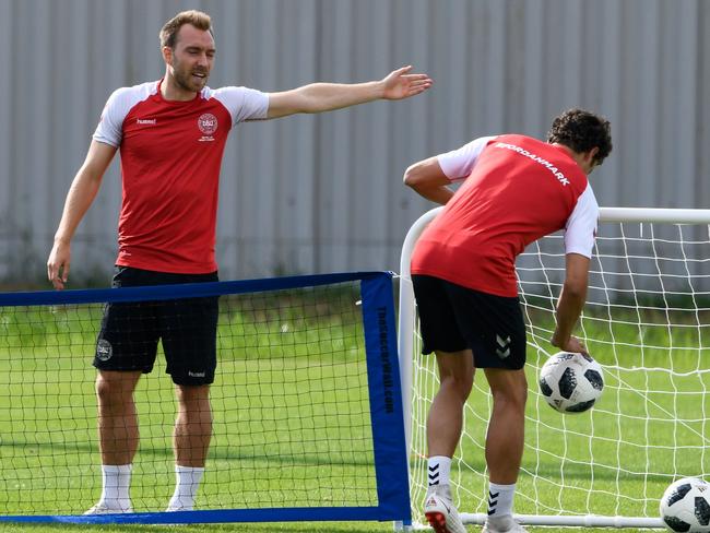 Eriksen directs traffic at Denmark training. Picture: AFP