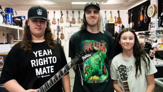 Gram Taylor, Alpha Wolf's Sabian Lynch and 11-year-old Alexis Clousen at Fosters Musics Burnie. Picture: Supplied