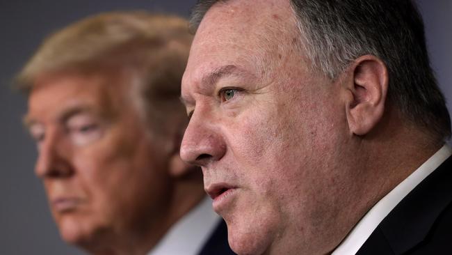 Mike Pompeo with Donald Trump last year at a briefing on the coronavirus outbreak in the US. Picture: Getty Images