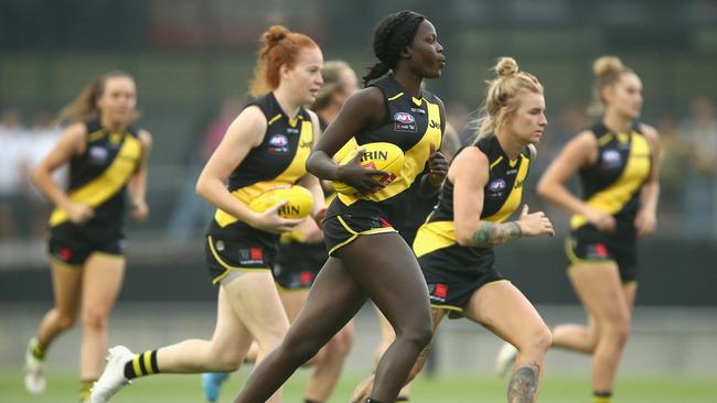 Akec Makur Chuot warming up with her Tigers teammates.