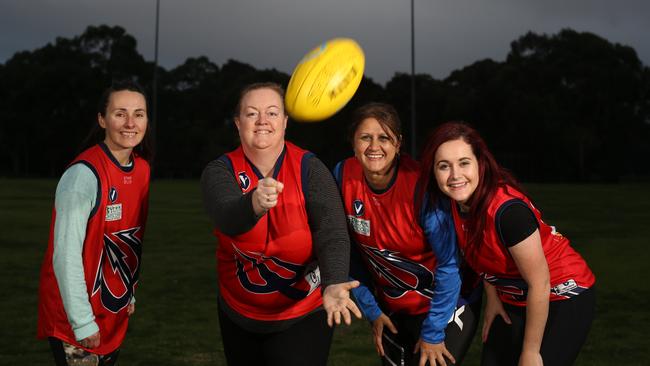 Kerry Hersom, Catherine Mortimer, Anne Tambakis and Samantha Fossey are part of the Box Hill North AFL Women's Masters team. Picture: Stuart Milligan