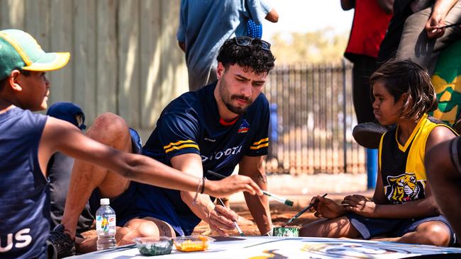 Adelaide’s Izak Rankine in the APY Lands this week to inspire hundreds of children and youth to get excited about maths and science. Picture: AFC