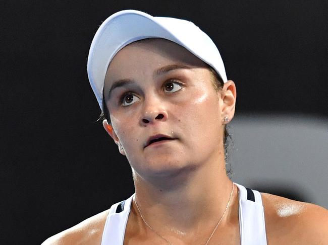 Ashleigh Barty of Australia is seen reacting during her first round match against Lesia Tsurenko of Ukraine at the Brisbane International Tennis Tournament in Brisbane, Monday, January 1, 2018. (AAP Image/Darren England) NO ARCHIVING, EDITORIAL USE ONLY