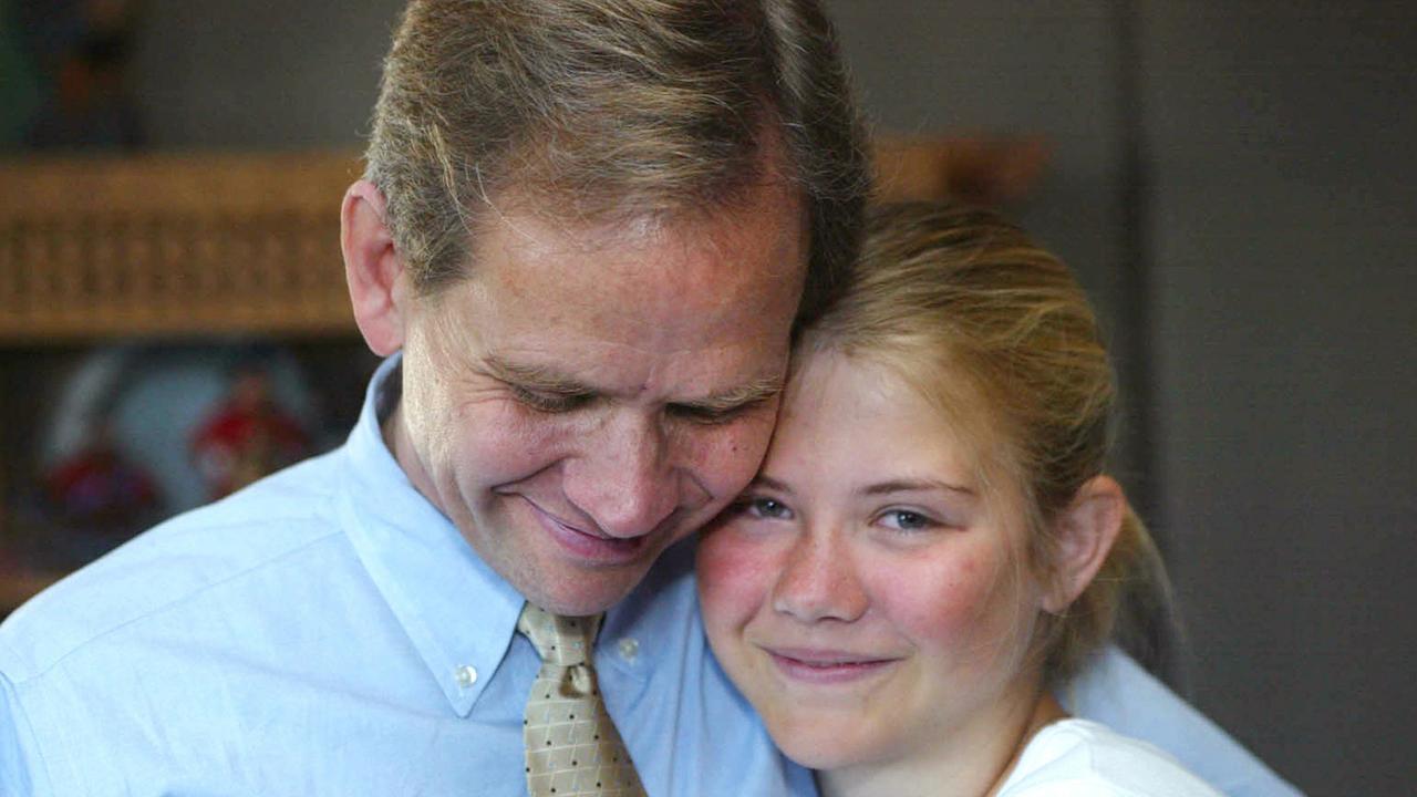 Elizabeth Smart with her father Ed at their Salt Lake City home the day after she was found.