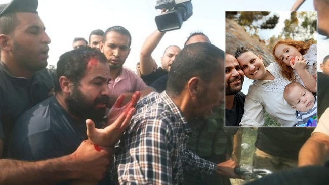 Yarden Bibas being kidnapped on October 7. Bibas family, inset: Yarden, 34; Shiri, 32; Ariel, 4; Kfir, almost 1.