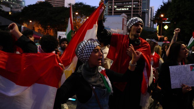 Protesters could be seen waving Palestinian flags while others marched the streets. Picture: NCA NewsWire/Tertius Pickard
