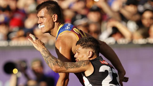 MELBOURNE, AUSTRALIA - SEPTEMBER 30: Bobby Hill of the Magpies tackles Brandon Starcevich of the Lions during the 2023 AFL Grand Final match between Collingwood Magpies and Brisbane Lions at Melbourne Cricket Ground, on September 30, 2023, in Melbourne, Australia. (Photo by Darrian Traynor/AFL Photos/via Getty Images)