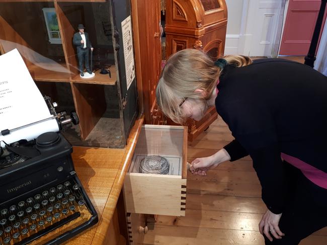 STORY BANK: A visitor peruses the exhibits Maryborough Story Bank. Photo: Contributed