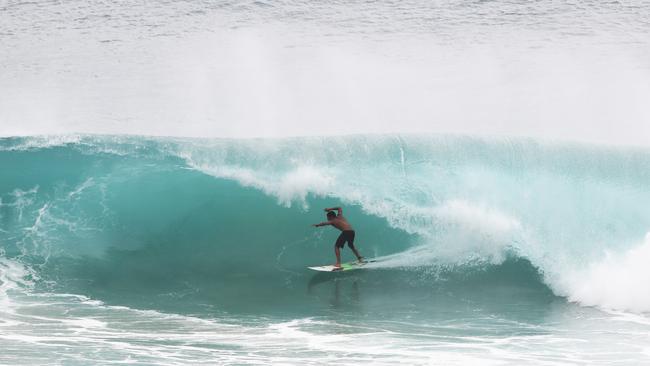 Surfers at Snapper Rocks and Kirra riding the Large swell produced by Cyclone OMA. Photograph : Jason O'Brien