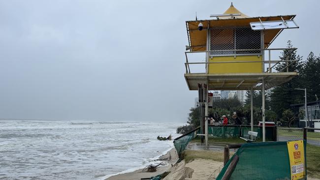 Lifeguard tower 40 at Main Beach Surf Life Saving Club on the Gold Coast where the beach has heavily eroded, right up to the base of the tower's concrete pad. Trees and fencing has also fallen down the sand cliff. Picture: Andrew Potts